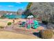 Community playground with colorful play structures and a surrounding green area at 1050 Dunedin Trl, Woodstock, GA 30188