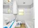 Bright white bathroom featuring classic fixtures, and a window for natural light at 2194 Ivydale St, Atlanta, GA 30344