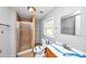 Bathroom featuring walk-in shower, shelving, sink, and toilet all in one place at 2194 Ivydale St, Atlanta, GA 30344