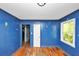 Bedroom with hardwood floors, blue trim, and natural light at 2194 Ivydale St, Atlanta, GA 30344