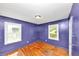 Bedroom with hardwood floors, natural light, and light purple walls at 2194 Ivydale St, Atlanta, GA 30344