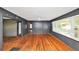 Spacious living room featuring hardwood floors, natural light, and a ceiling fan at 2194 Ivydale St, Atlanta, GA 30344