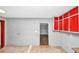 Spacious room with wall-mounted cabinets and access to other rooms in the home at 2194 Ivydale St, Atlanta, GA 30344