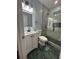 Stylish bathroom featuring modern vanity, walk-in shower with tile, and modern lighting at 4321 Austell Powder Springs Sw Rd, Powder Springs, GA 30127