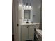 Bathroom features modern vanity with white cabinets, lighted mirror, and black fixtures at 4321 Austell Powder Springs Sw Rd, Powder Springs, GA 30127
