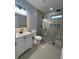 Contemporary bathroom featuring a glass-enclosed shower and elegant vanity, offering a spa-like experience at 4321 Austell Powder Springs Sw Rd, Powder Springs, GA 30127