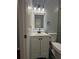 Bright bathroom showcasing a modern vanity, sleek fixtures, and a glass-enclosed shower at 4321 Austell Powder Springs Sw Rd, Powder Springs, GA 30127