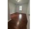 Bedroom featuring hardwood floors and neutral-colored walls, creating a peaceful and inviting atmosphere at 4321 Austell Powder Springs Sw Rd, Powder Springs, GA 30127
