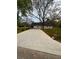 Long driveway leading to a charming home with well maintained lawn and mature trees at 4321 Austell Powder Springs Sw Rd, Powder Springs, GA 30127