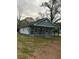 Beautiful side view of home with a manicured lawn and covered porch at 4321 Austell Powder Springs Sw Rd, Powder Springs, GA 30127