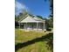 Charming single-story home with a covered porch and well-maintained lawn at 4321 Austell Powder Springs Sw Rd, Powder Springs, GA 30127