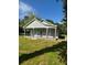 Charming home exterior featuring neutral paint, stone accents, and well-manicured lawn at 4321 Austell Powder Springs Sw Rd, Powder Springs, GA 30127