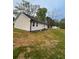 Exterior view of home with new paint, windows, and trim at 4321 Austell Powder Springs Sw Rd, Powder Springs, GA 30127
