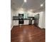 Modern kitchen with stainless steel appliances, white cabinets, and dark countertops at 4321 Austell Powder Springs Sw Rd, Powder Springs, GA 30127