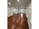 Bright living room with hardwood floors, neutral paint and a window to let in natural light at 4321 Austell Powder Springs Sw Rd, Powder Springs, GA 30127