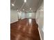 Spacious living room with hardwood floors, fresh paint, and recessed lighting at 4321 Austell Powder Springs Sw Rd, Powder Springs, GA 30127