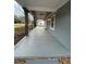 Inviting covered front porch with stone supports and black railing enhances curb appeal at 4321 Austell Powder Springs Sw Rd, Powder Springs, GA 30127
