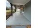Spacious porch with stone columns, dark wrought iron railing and lighting, ideal for outdoor relaxation at 4321 Austell Powder Springs Sw Rd, Powder Springs, GA 30127