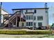 Two-story home with deck, and a backyard featuring outdoor living spaces at 6770 Ulster Ct, Alpharetta, GA 30005