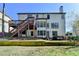 Two-story home with deck, and a backyard featuring outdoor living spaces at 6770 Ulster Ct, Alpharetta, GA 30005