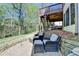 Beautiful backyard featuring a patio with seating and stairs leading to the deck at 6770 Ulster Ct, Alpharetta, GA 30005