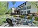 Large backyard featuring a fire pit, a relaxing patio and lush surroundings at 6770 Ulster Ct, Alpharetta, GA 30005