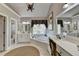 Bathroom featuring dual vanities, soaking tub, and a large window for natural light at 6770 Ulster Ct, Alpharetta, GA 30005