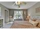 This bedroom features neutral colors, a comfortable bed, and a window with natural light at 6770 Ulster Ct, Alpharetta, GA 30005