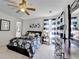 Bright bedroom featuring a patterned comforter, ceiling fan, dresser, and stylish decor, creating a peaceful retreat at 6770 Ulster Ct, Alpharetta, GA 30005