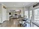 Eat-in kitchen nook open to the living room with a dark wood table set for four at 6770 Ulster Ct, Alpharetta, GA 30005