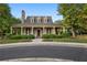 Charming clubhouse exterior with inviting covered porch and well-manicured landscaping at 6770 Ulster Ct, Alpharetta, GA 30005