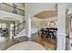 Elegant foyer featuring hardwood floors, staircase, dining room, and great natural lighting at 6770 Ulster Ct, Alpharetta, GA 30005