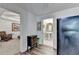 View of a refrigerator, hallway, powder room, and chair in this home at 6770 Ulster Ct, Alpharetta, GA 30005