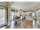 Spacious kitchen opens to dining area with stainless appliances and gleaming hardwood floors at 6770 Ulster Ct, Alpharetta, GA 30005