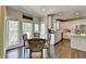 Kitchen and breakfast nook features bright light, stainless appliances, and quartz counters at 6770 Ulster Ct, Alpharetta, GA 30005