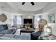 Cozy living room featuring hardwood floors, a comfortable sofa, and a flat-screen TV for entertainment at 6770 Ulster Ct, Alpharetta, GA 30005