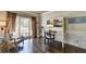 Bright office space with hardwood floors, built-in desk, and large window at 6770 Ulster Ct, Alpharetta, GA 30005