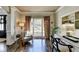 Cozy office featuring hardwood floors, natural light, and built-in shelving at 6770 Ulster Ct, Alpharetta, GA 30005