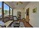 Screened porch with comfortable wicker furniture and decor for relaxed outdoor living at 6770 Ulster Ct, Alpharetta, GA 30005