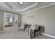 View of sitting room adjacent to primary bedroom, showing fireplace and comfortable seating area at 6770 Ulster Ct, Alpharetta, GA 30005