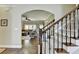 View of the living room from the staircase featuring hardwood floors and comfortable seating at 6770 Ulster Ct, Alpharetta, GA 30005