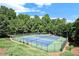 Overhead view of community tennis courts surrounded by green space and trees at 6770 Ulster Ct, Alpharetta, GA 30005
