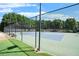 Beautiful tennis courts with well maintained fence, court, and net at 6770 Ulster Ct, Alpharetta, GA 30005