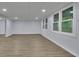 Finished basement with recessed lighting and new flooring at 9415 Martin Rd, Roswell, GA 30076