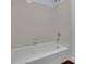 Bathroom features white tile, white bathtub, and silver fixtures at 9415 Martin Rd, Roswell, GA 30076