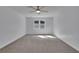 Minimalist bedroom with plush carpet, ceiling fan and ample natural light at 9415 Martin Rd, Roswell, GA 30076