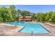 Large community pool with ample seating and sunbathing areas, perfect for relaxation and recreation at 9415 Martin Rd, Roswell, GA 30076