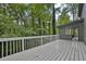 Wooden deck with white railings overlooking trees at 9415 Martin Rd, Roswell, GA 30076