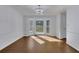 Bright dining room with hardwood floors and a sunlit bay window at 9415 Martin Rd, Roswell, GA 30076