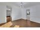 Dining room with hardwood floors and a modern chandelier fixture at 9415 Martin Rd, Roswell, GA 30076
